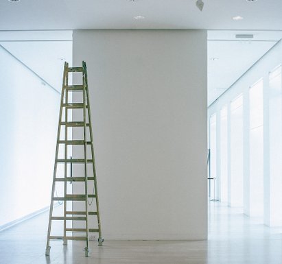 Freshly white painted hallway with ladder